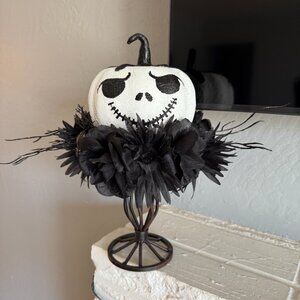 Homemade Jack Skellington mounted on metal candle stick